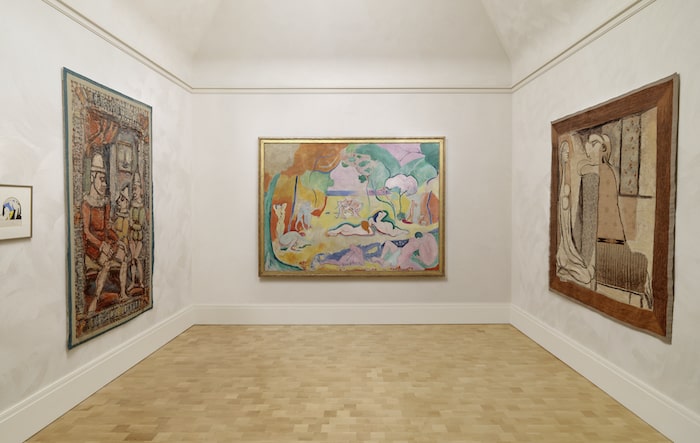 Rouault’s Little Family (left) and Picasso’s Secrets (right) with Matisse’s painting Le bonheur de vivre, stairwell, The Barnes Foundation