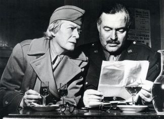 Hemingway with fellow American writer and journalist Janet Flanner, wearing their war correspondent uniforms in 1944 Paris