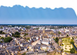 An aerial view of Vannes, overlooking its fortified city walls and lawns with floral design