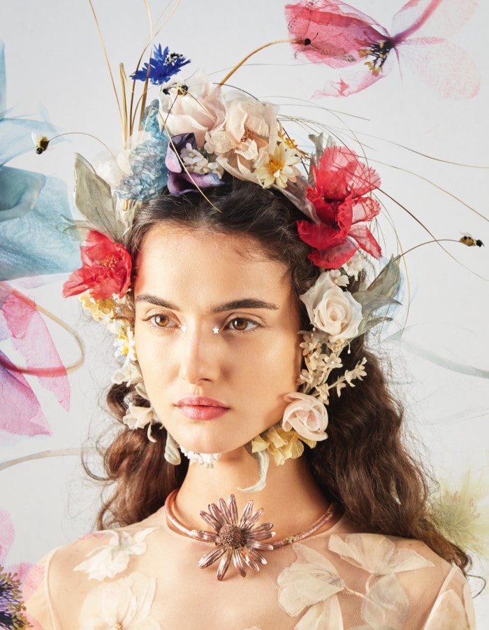 A headdress made of silk wildflowers and adorned with bees from the Spring-Summer 2017 Haute Couture collection