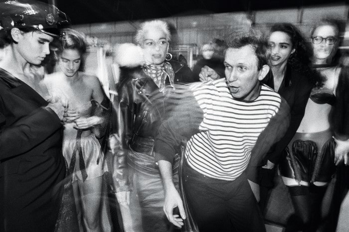 Throwback photo of Jean Paul Gaultier backstage with his models, photo can be seen at the Cinematheque exhibition