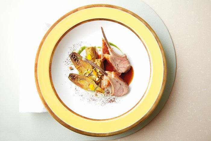 roast lamb with artichokes and edible flowers is one of the dishes inspired by the royal feasts once enjoyed at the court of Louis XIV 